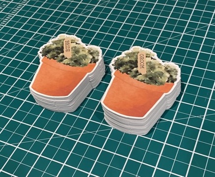 Stacks of finished flowerpot place cards ready for a garden wedding