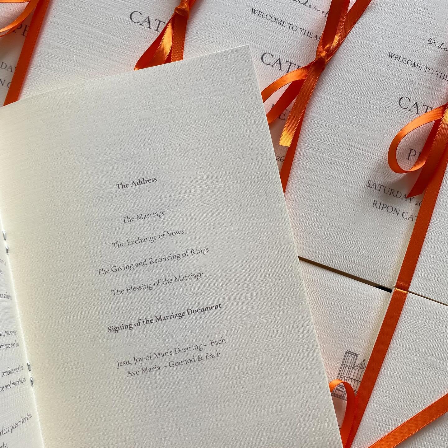 Wedding order of service booklets with orange ribbon - ceremony stationery Kent